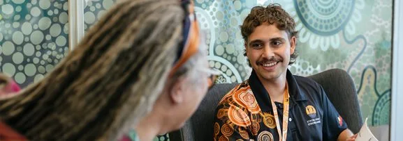 A friendly discussion with a strong spirit strong mind aboriginal programs trainer.