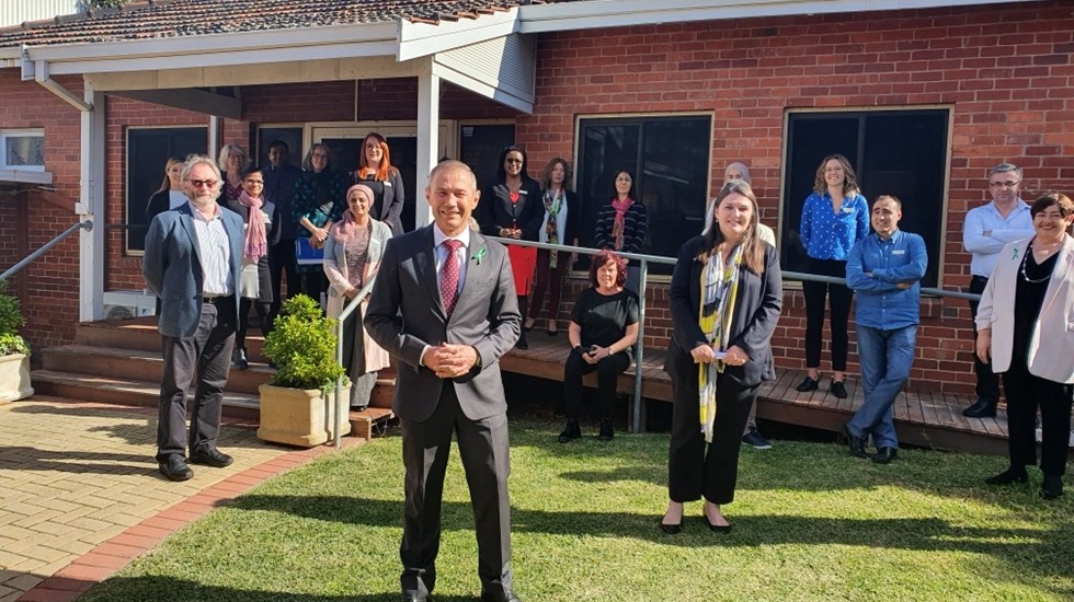 Minister for Mental Health Roger Cook pictured with the asetts team outside their Perth premises