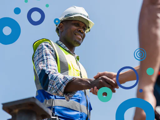 Construction working shaking someone's hand.